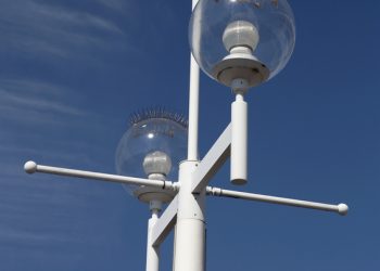 Street lights with spikes on the tops to stop birds roosting and pooing on them, the pier st Petersburg florida united states America usa taken in march 2006